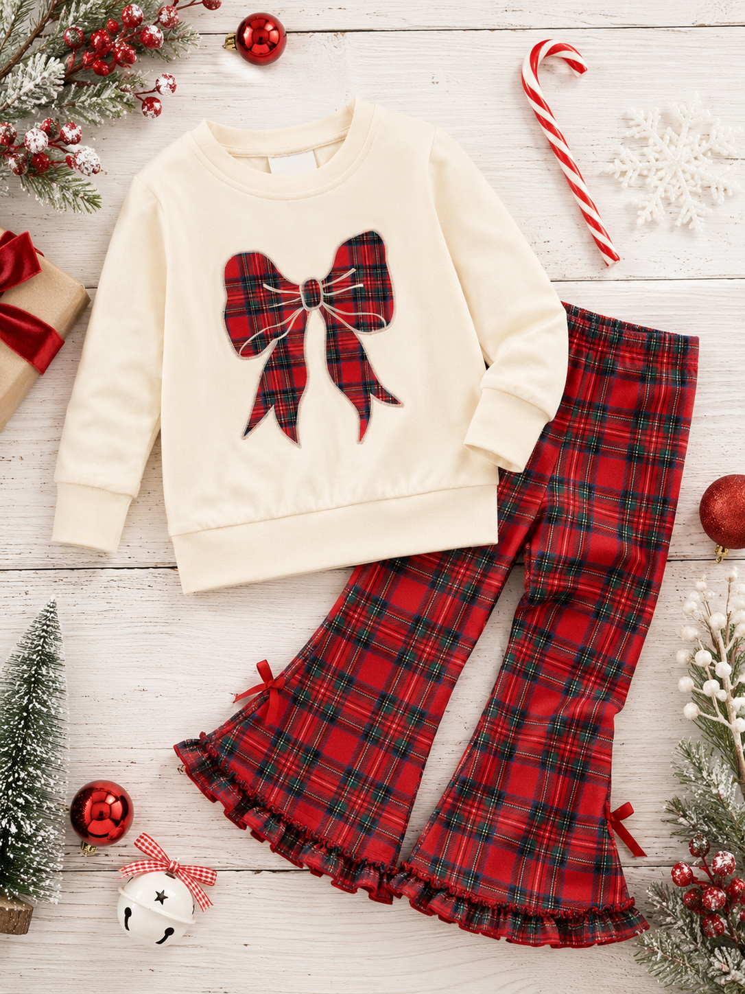 creak plaid bow sweater with plaid ruffle pants on wood background