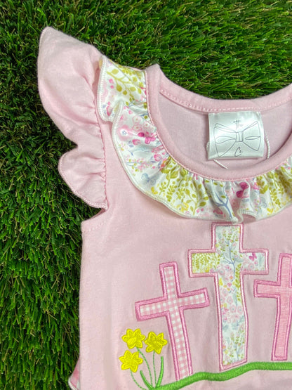 up close image of cross romper neckline