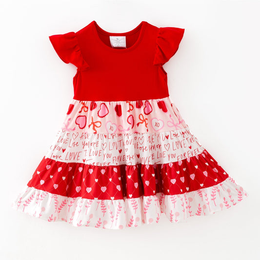 Red and white dress with heart patterns on a white background