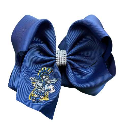 Blue hair bow with embroidered design and rhinestone center on a white background