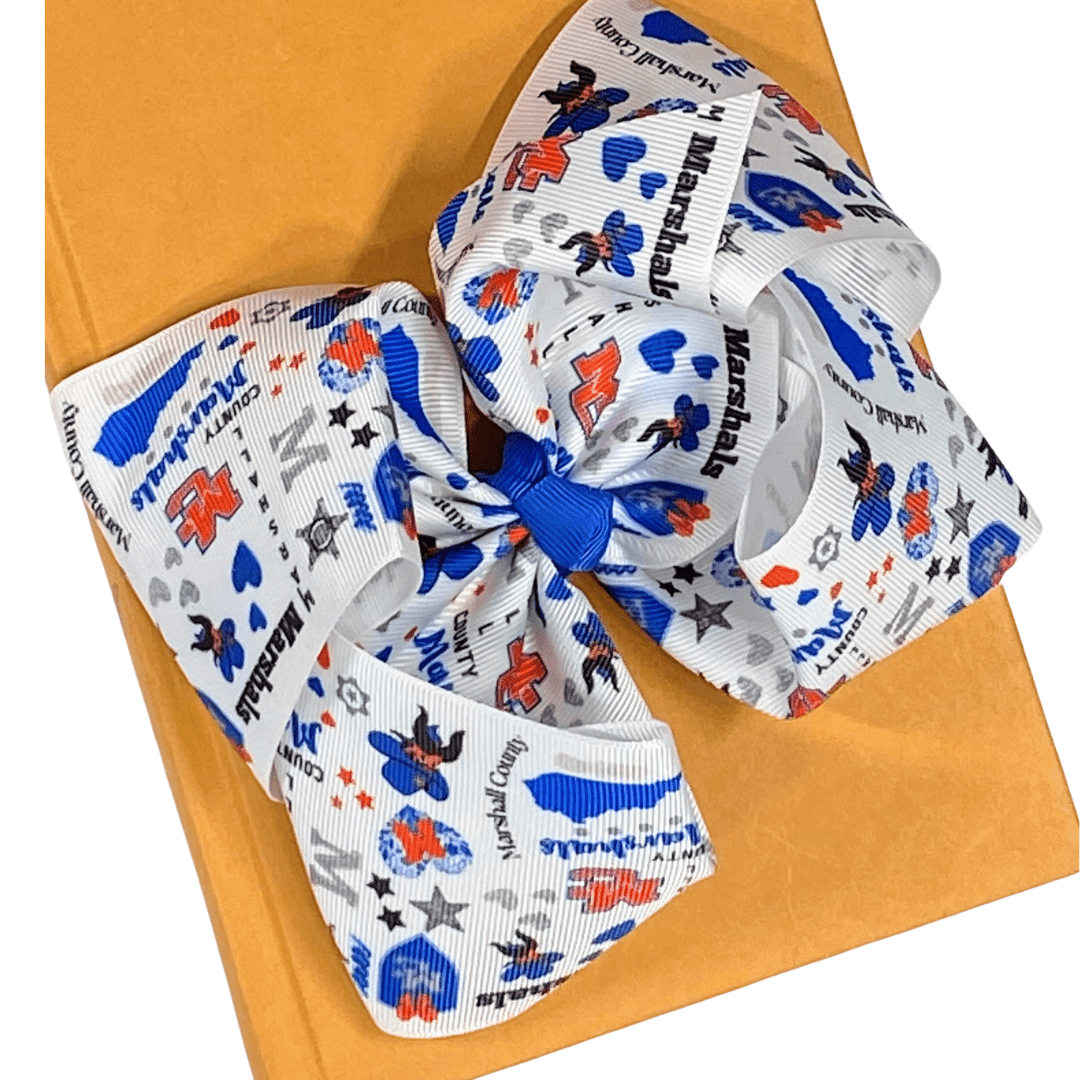 Large decorative bow with colorful patterns on a yellow background