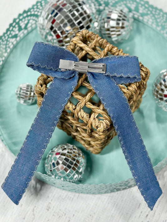 Back of denim ruffle edge hair bow showing alligator clip - Alternative view