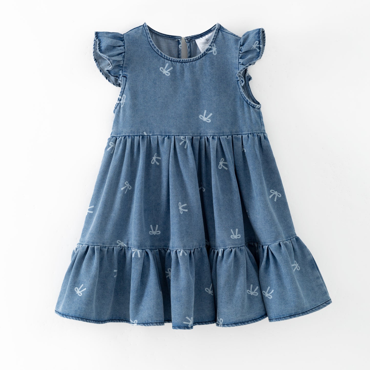 Blue denim bow print dress with ruffled sleeves and bottom on a white background