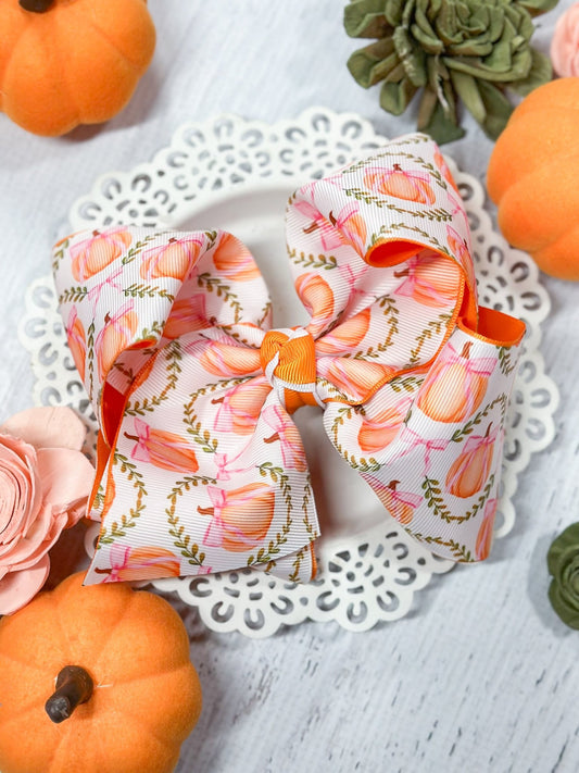 Double layered pumpkin hair bow on alligator clip