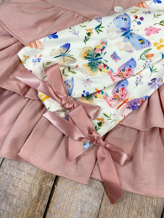 Pink tiered dress and butterfly pattern pants on a wooden background - Alternative view