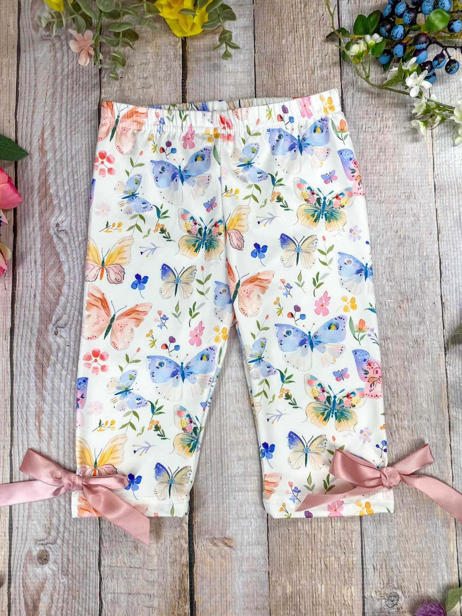 butterfly pattern pants on a wooden background