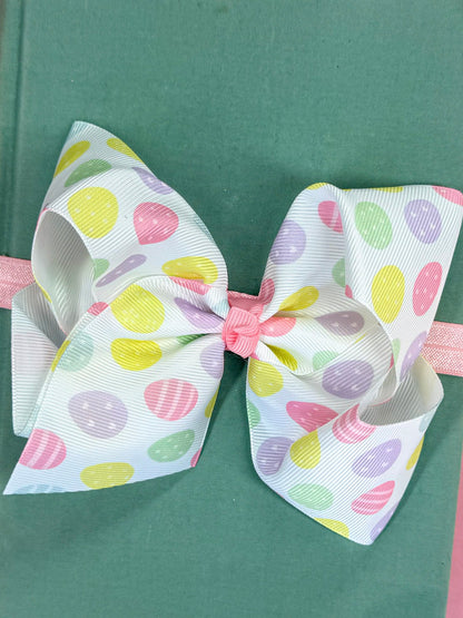 Pastel Easter egg headband with white grosgrain ribbon and soft nylon band