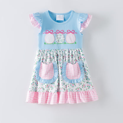 Girls blue Easter dress with embroidered Easter eggs, floral skirt, gingham ruffle hem and pockets, boutique spring dress