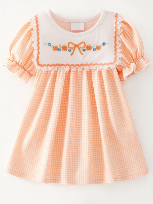 girls fall boutique dress with pumpkin embroidery on peach gingham and lace bib detail