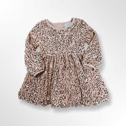 Children's dress with pink sequin pattern on a white background