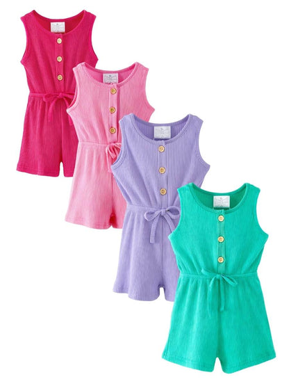 Four colorful rompers in pink, purple, and green on a white background