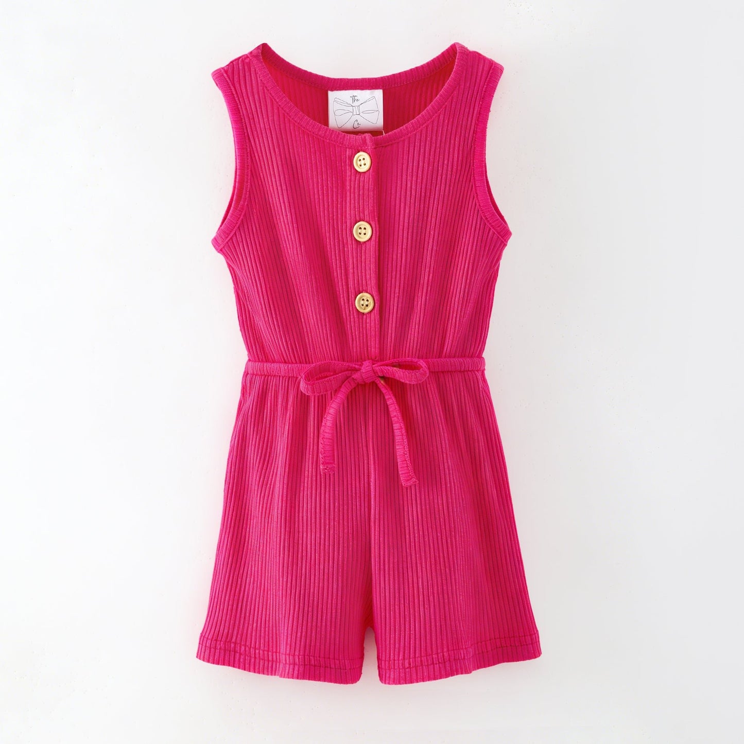 Pink romper with buttons on a white background
