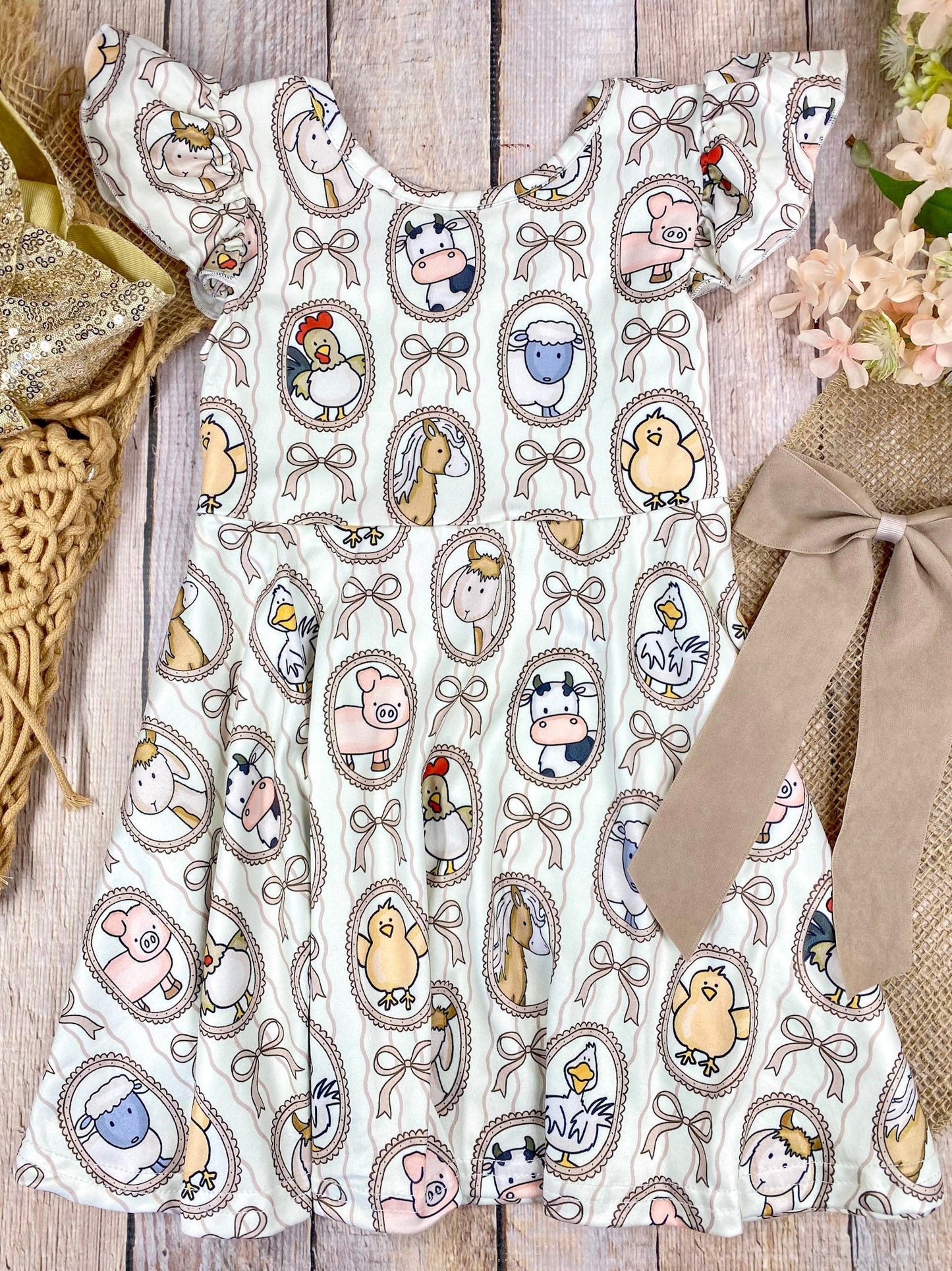 Boutique Girls Farm Animal Dress on a wooden background