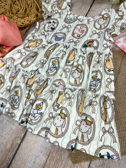 Children's outfit with patterned top on a wooden background