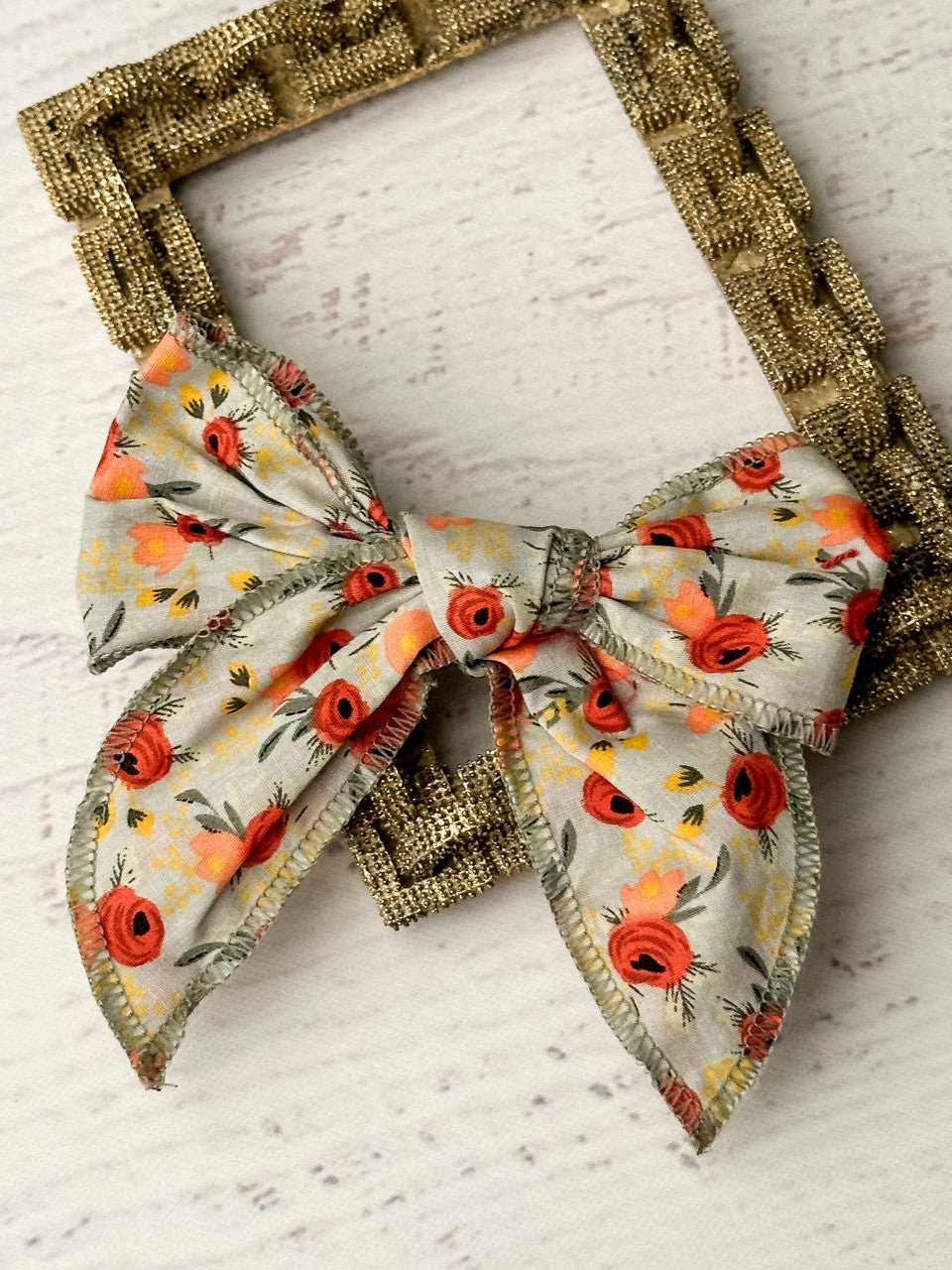 Floral print hand tied hair bow on removable alligator clip
