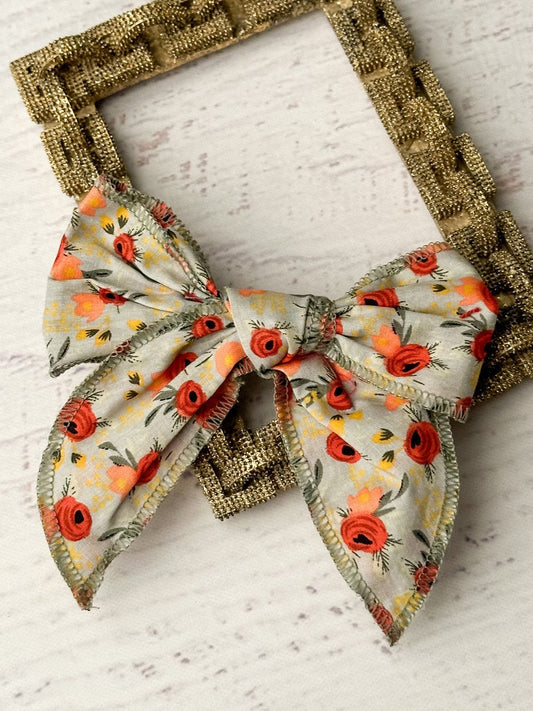 Floral print hand tied hair bow on removable alligator clip