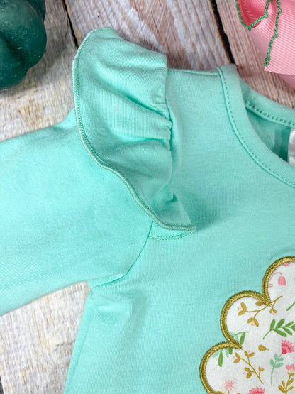 close up of ruffles on shoulder