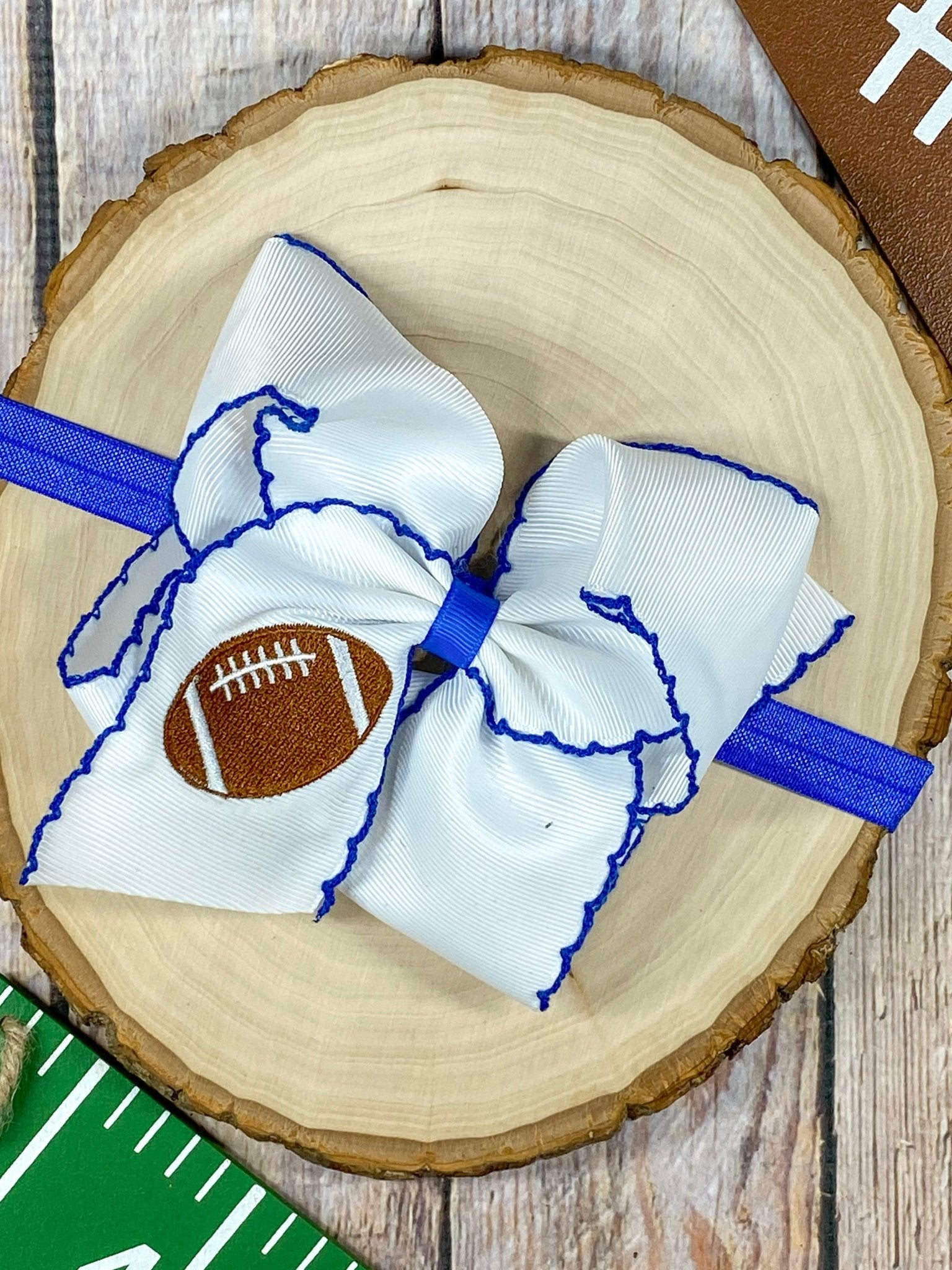 Football Embroidered Moonstitch Bow Headband with blue stitching
