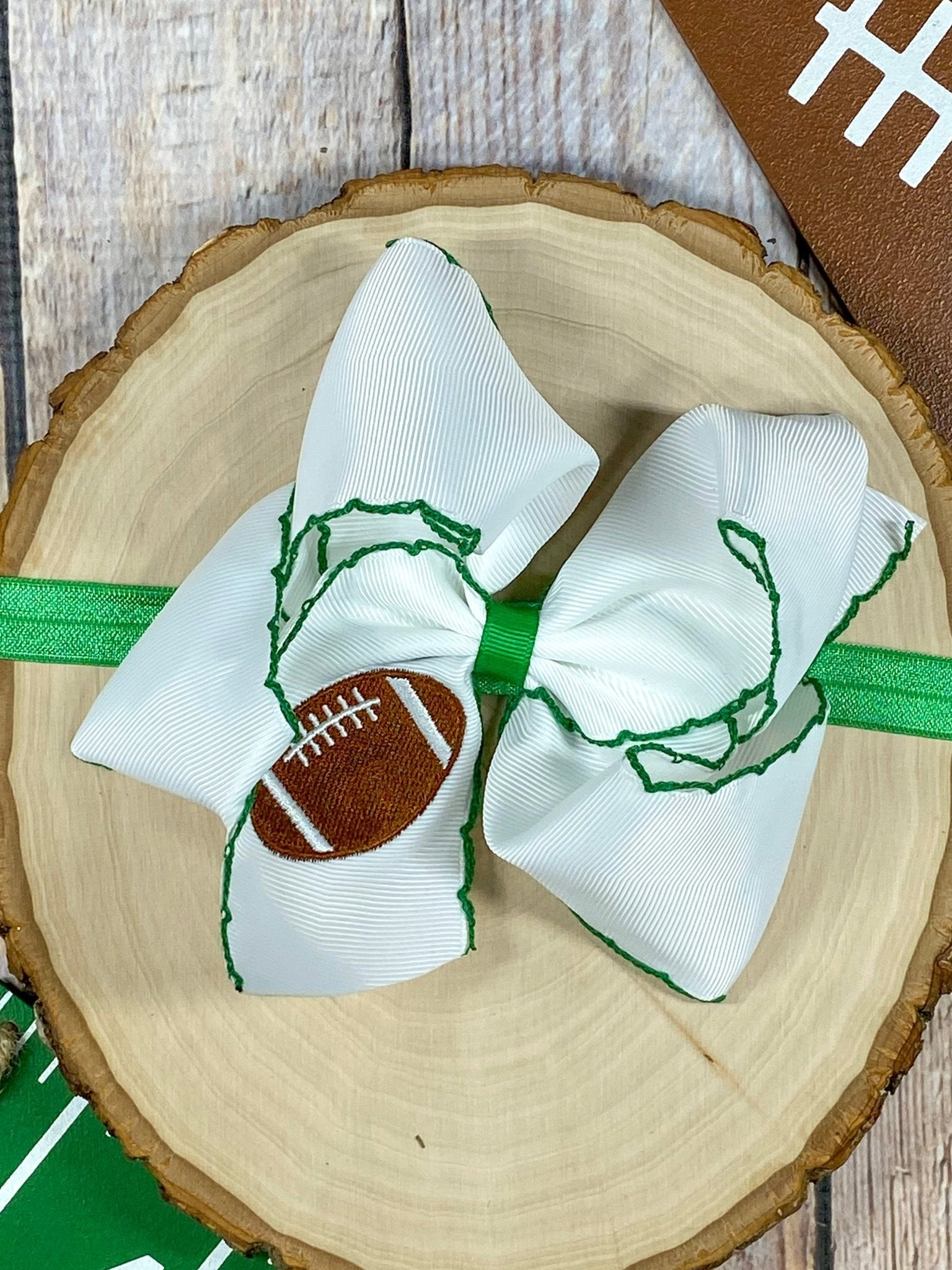 Football Embroidered Moonstitch Bow Headband with green stitching