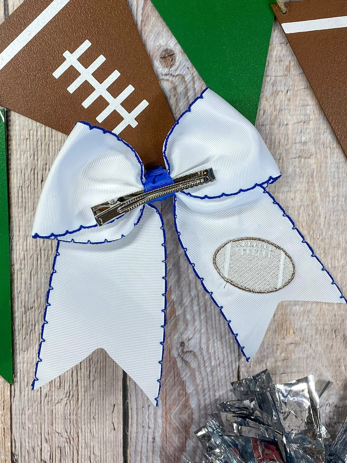 Back of football embroidered moonstitch cheer bow