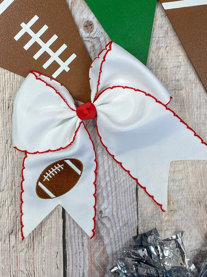 White football embroidered moonstitch cheer bow with red stitching