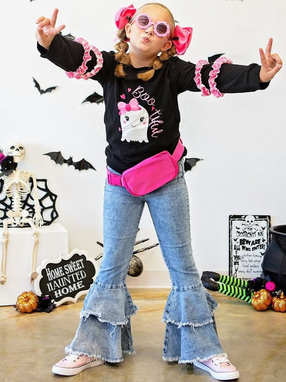 Girl wearing frayed double bell bottom jeans