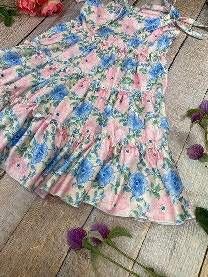 blue and pink Floral Tie Strap Tiered Dress for girls on a wooden background