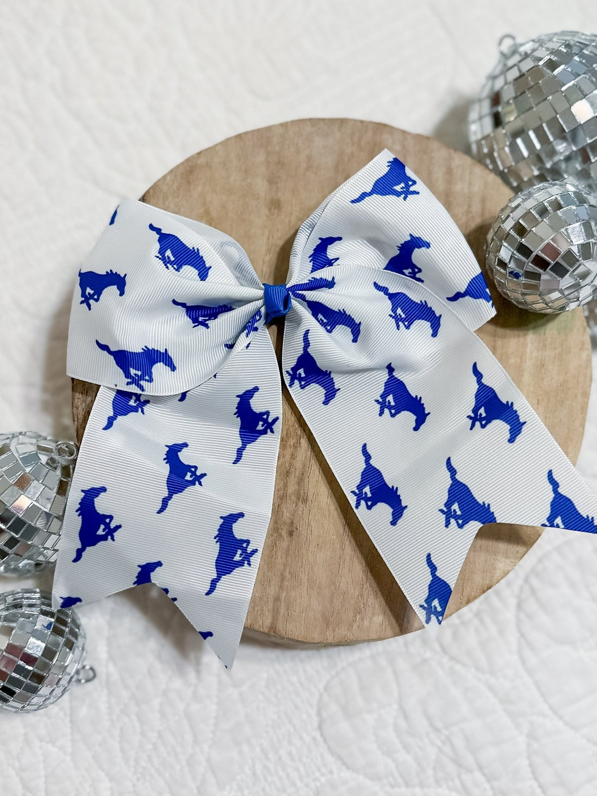 Friendswood Mustangs cheer bow on a Pony-O hair tie