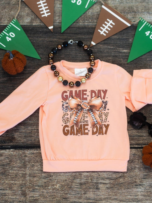 Girls long sleeve with a game day football bow