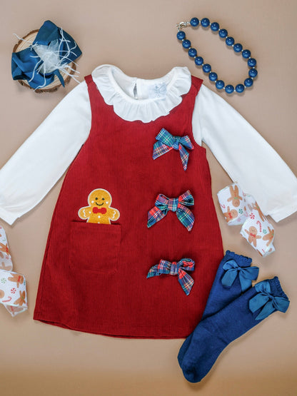 Red corduroy gingerbread jumper dress with a white ruffle blouse
