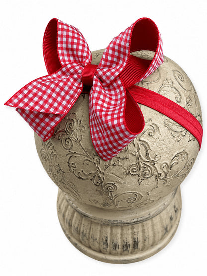 Red gingham hair bow on headband