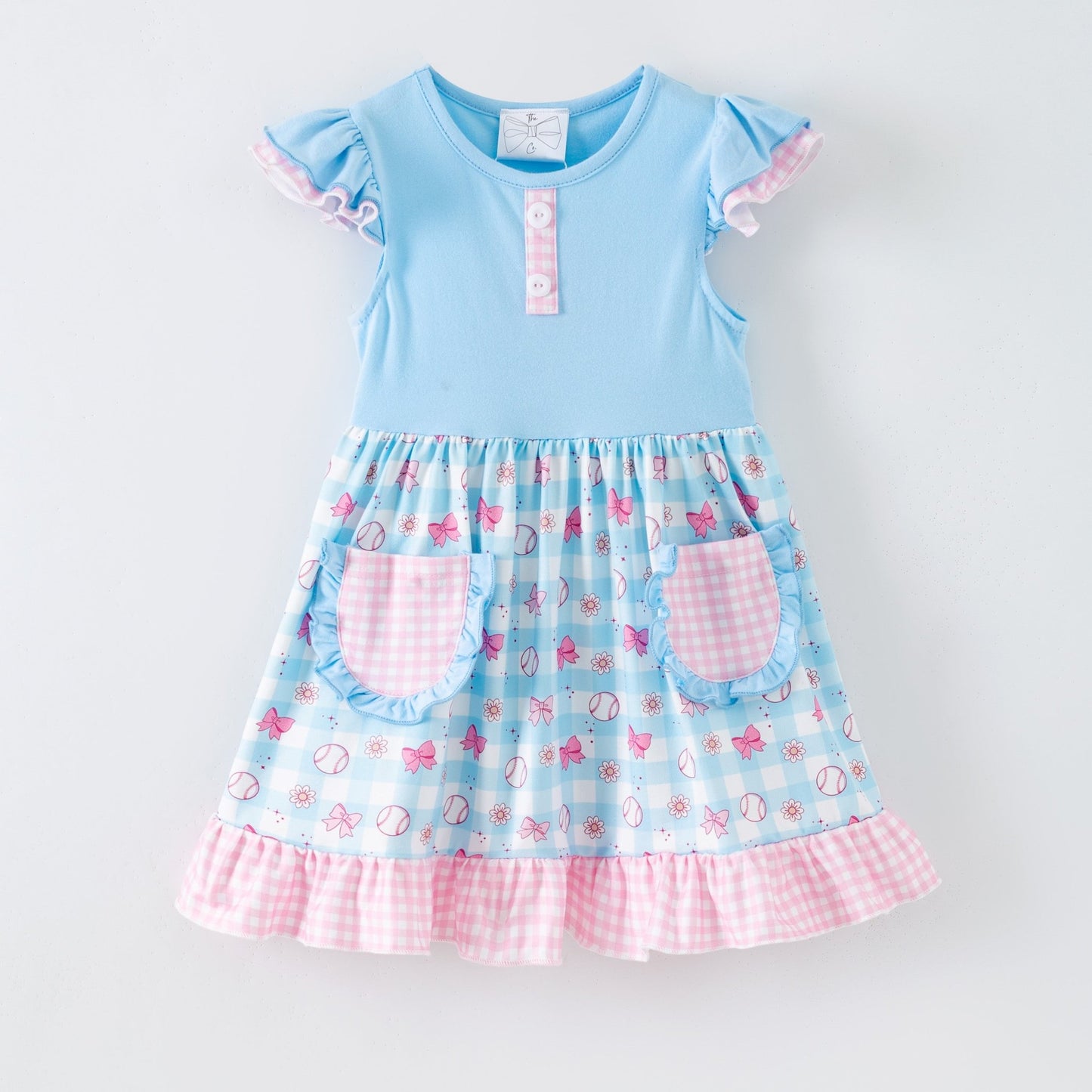 Light blue dress with pink accents and floral pattern on a white background