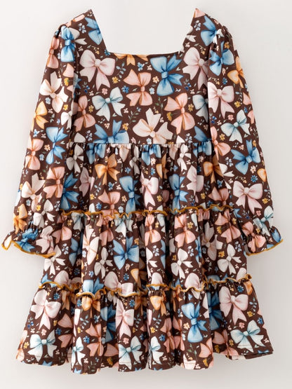 Girls brown bow print tiered dress with long sleeves and ruffle details