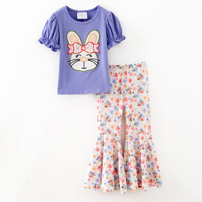 Girls Easter outfit with purple bunny top and floral pants on a white background