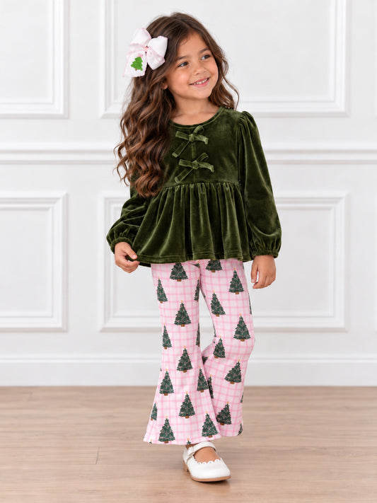model wearing our green velvet top with bows and pink plaid Christmas tree bell bottoms