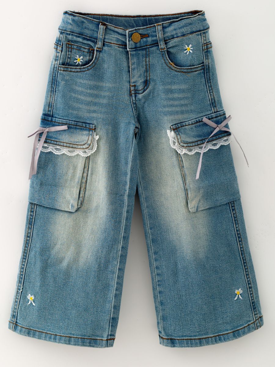Light-wash girls’ wide leg jeans with lace-trimmed cargo pockets, lavender bows and embroidered daisies