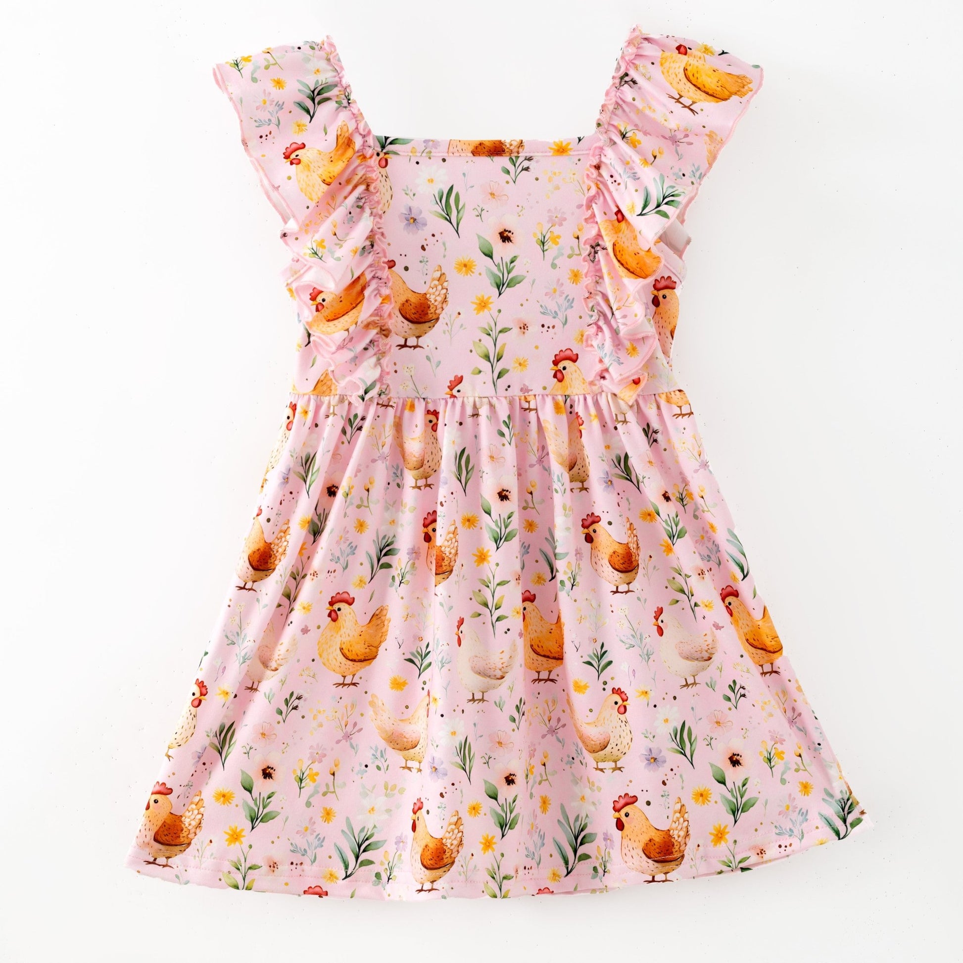 Pink dress with chicken and flower pattern on a white background