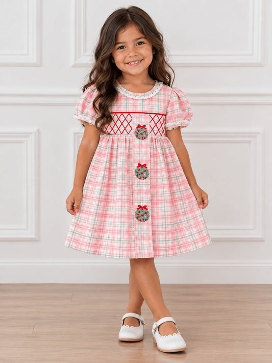 Pink plaid girls dress with a smocked waist and wreaths
