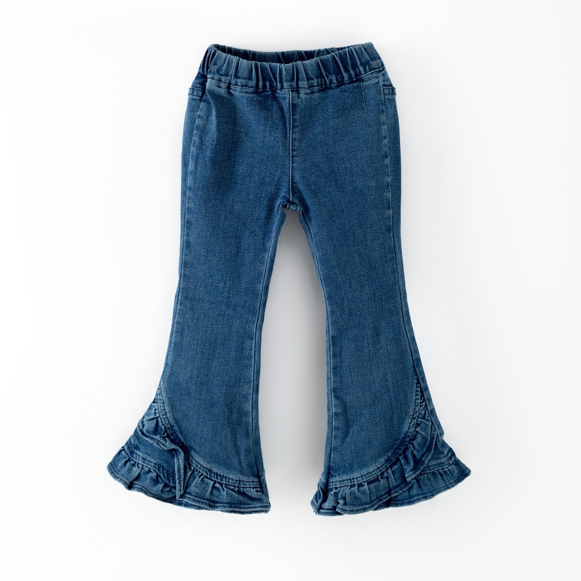 girls boutique Blue jeans with ruffled cuffs on a white background