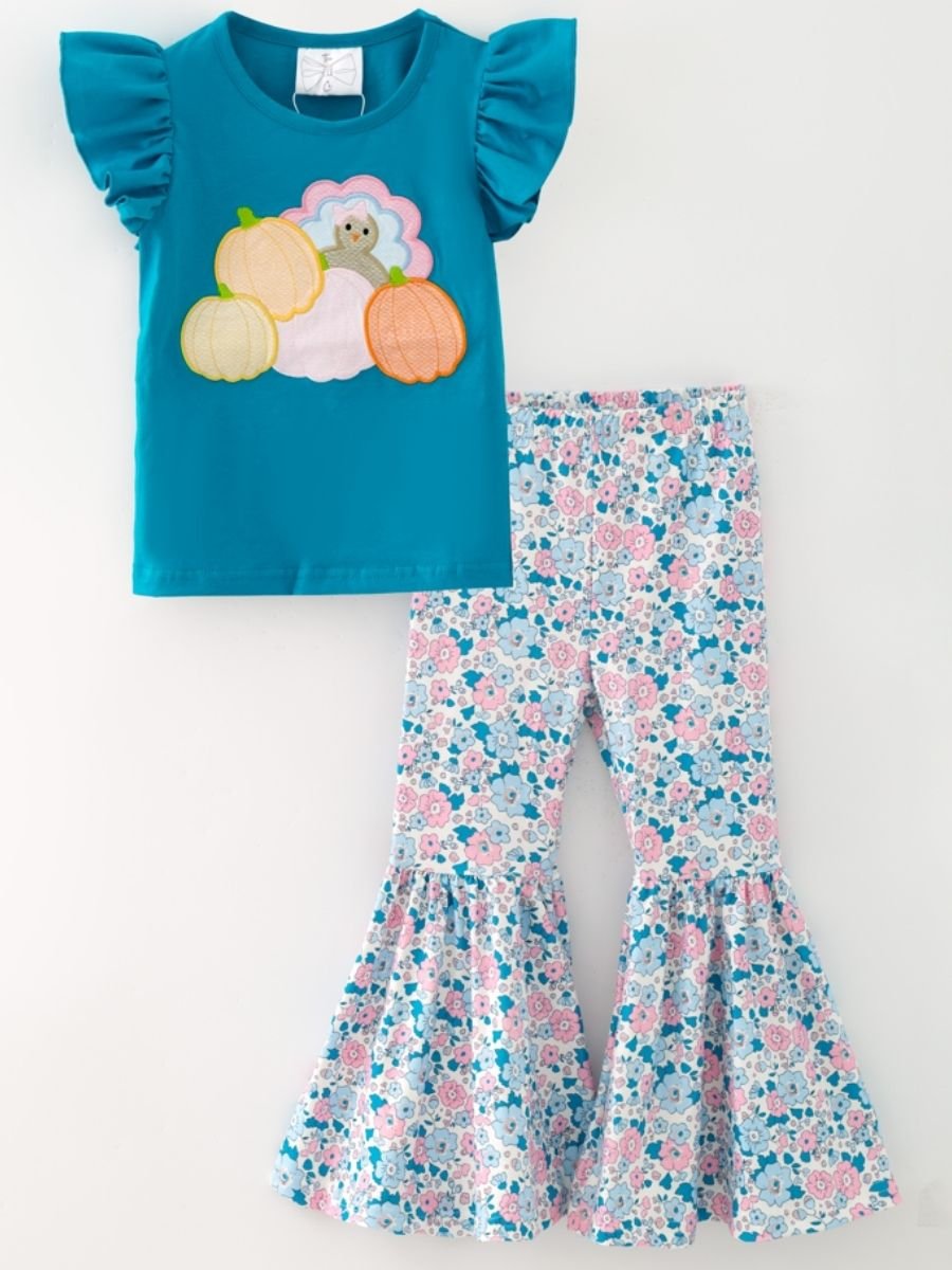 Teal turkey top and floral bell bottoms on white