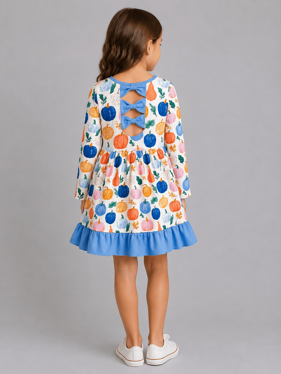 Back of Girls Watercolor Pumpkin Ruffle Dress with Blue Bow Back Detail, Long Sleeves and Fall Pumpkin Print