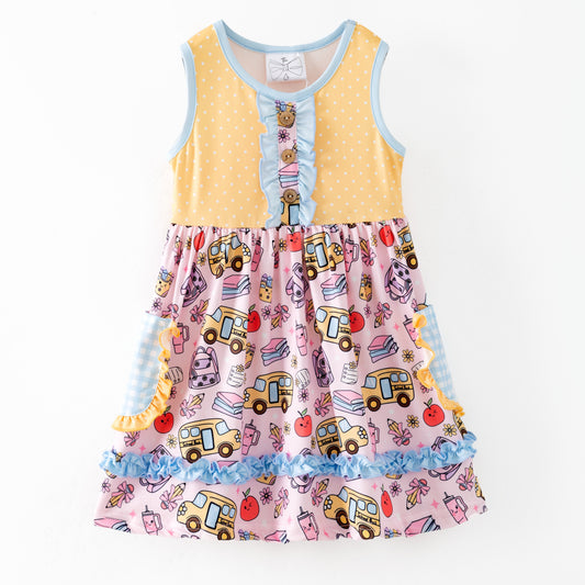 Colorful children's dress with cartoon bus and apple pattern on a white background