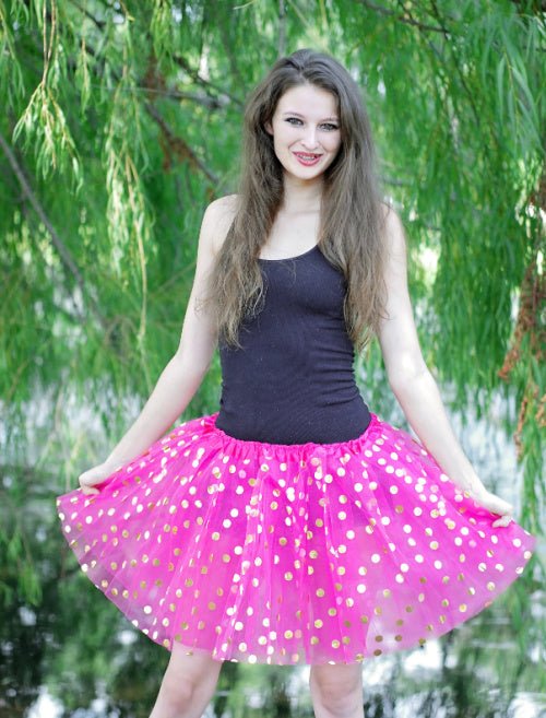 model wearing gold dot tutu outdoors