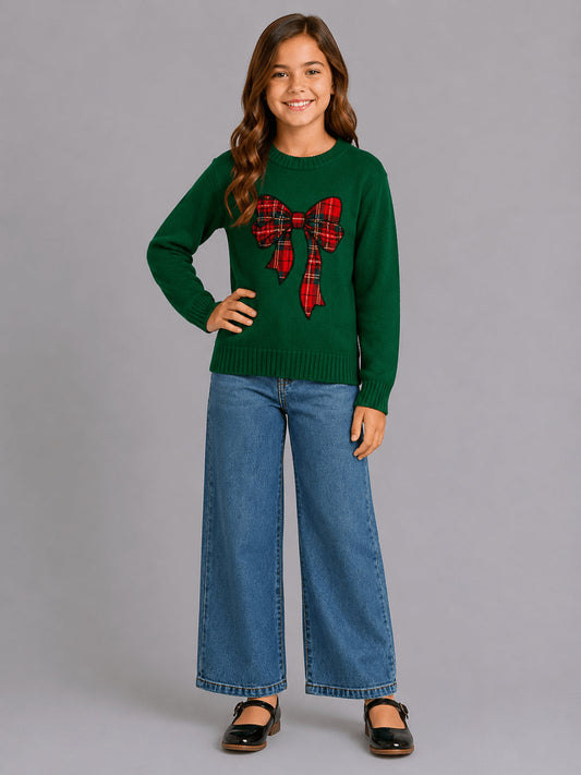 Girls emerald green Christmas sweater with red plaid bow laid flat