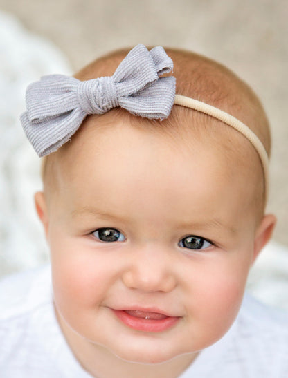 Stretchy corduroy bow headbands IN GREY ON MODEL