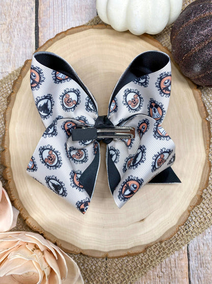 Haunted Mystery Hair Bow on a wooden background