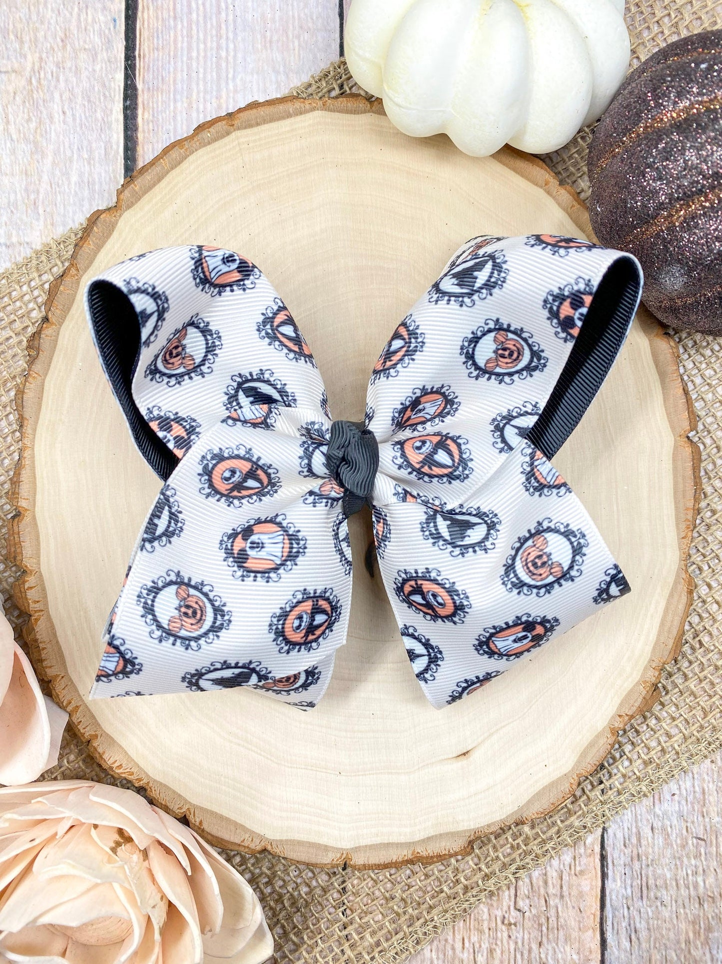 Haunted Mystery Hair Bow on a wooden background