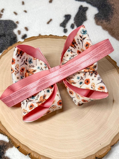 back of the bow headband showing the satin elastic band