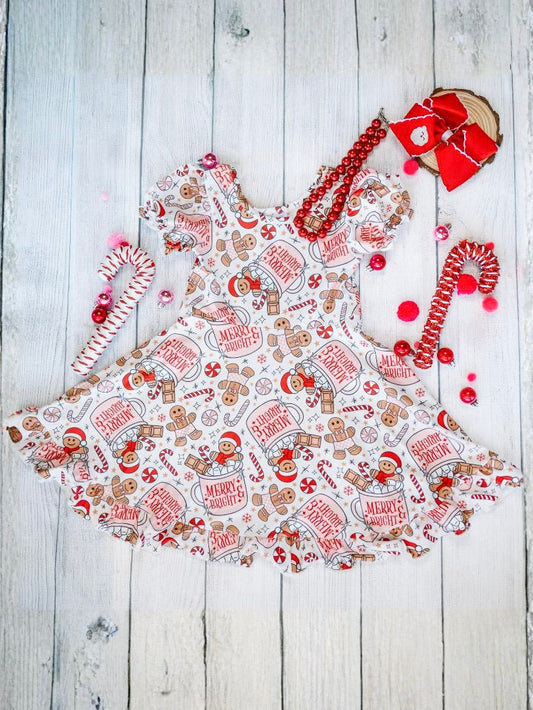 Gingerbread print girls Christmas dress on a wooden surface - Alternative view