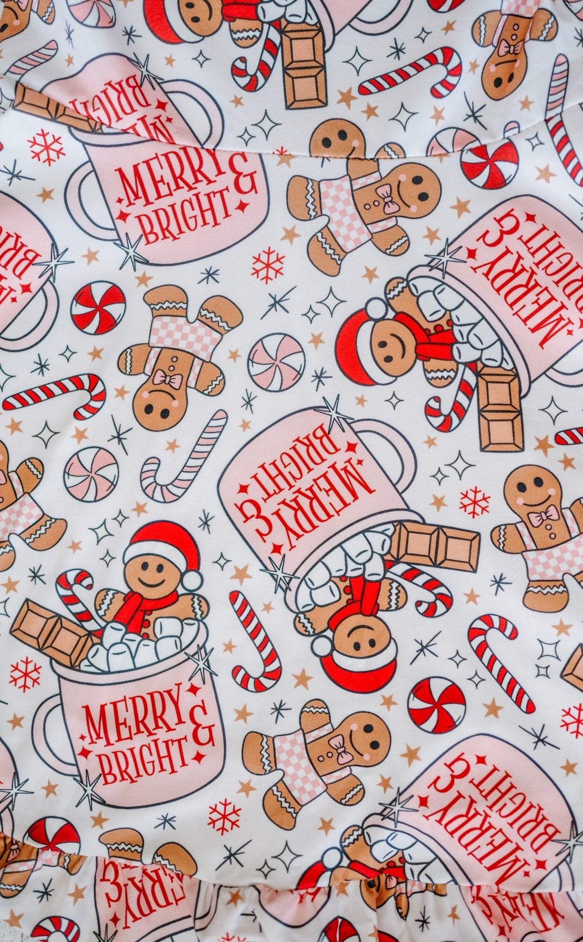 Close-up of hot cocoa and gingerbread print fabric